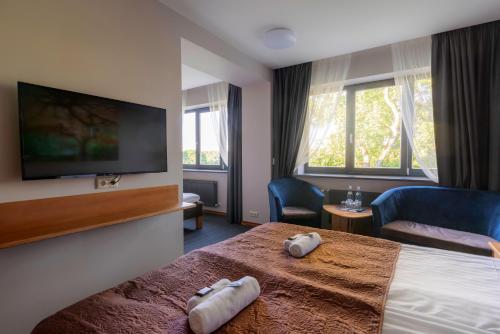 Comfort Hotel Kuldiga客房内的一张或多张床位