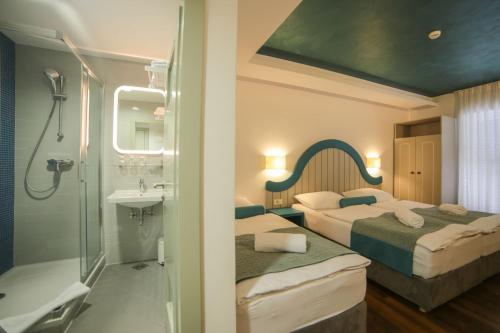 Hotel Ivando客房内的一张或多张床位