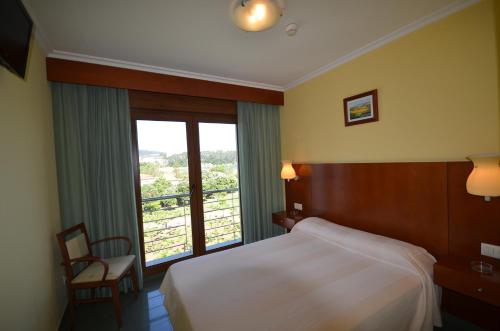 Hotel Maracaibo客房内的一张或多张床位