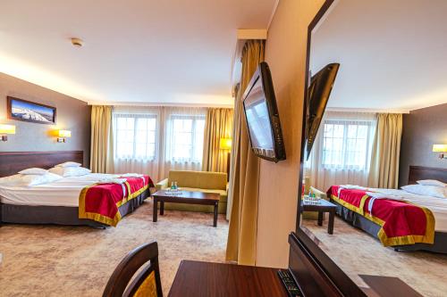 克里兹塔尔会议及Spa酒店客房内的一张或多张床位