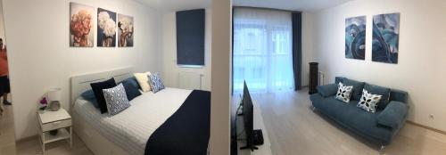 布达佩斯Rozsa 55 Appartment的客厅配有床和沙发
