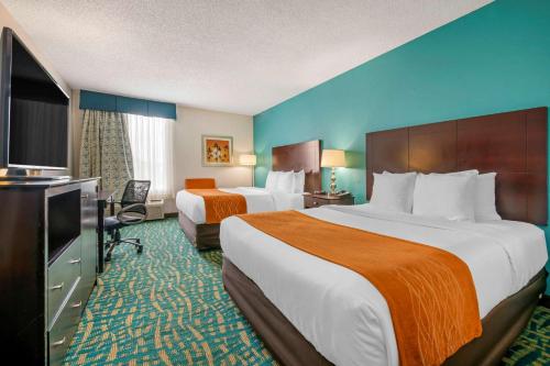Comfort Inn & Suites Fort Lauderdale West Turnpike客房内的一张或多张床位