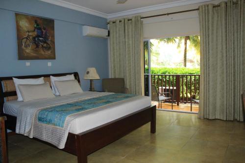 博约海滩度假酒店客房内的一张或多张床位