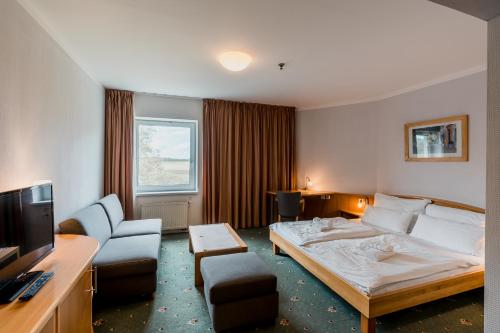奥洛穆茨普拉查尔纳公园酒店客房内的一张或多张床位