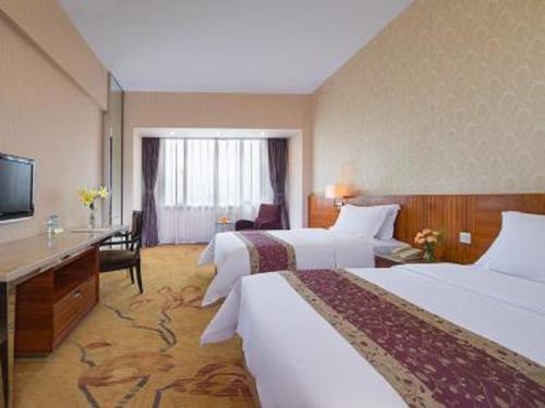 维也纳国际酒店佛山南海海悦店客房内的一张或多张床位