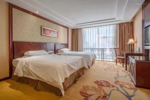 维也纳酒店广州越秀惠福西路店客房内的一张或多张床位