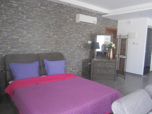 海滨211公寓式酒店客房内的一张或多张床位