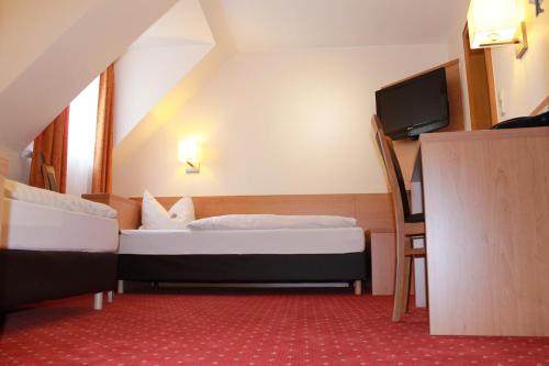 Hotel Hübler客房内的一张或多张床位