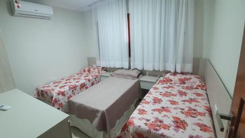 Casa Darci - Beira-mar, no Condomínio Village客房内的一张或多张床位