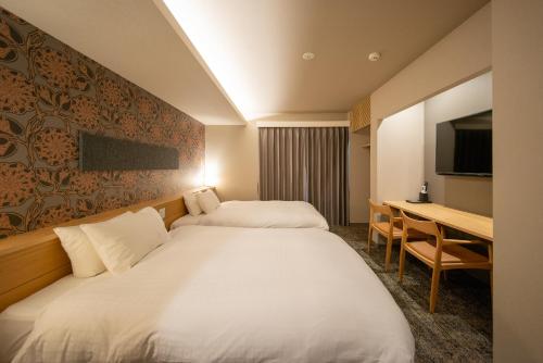Hotel Celeste Shizuoka客房内的一张或多张床位
