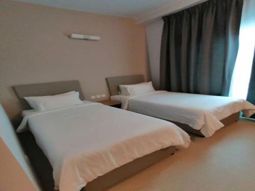 Serapi Verdure Hotel客房内的一张或多张床位