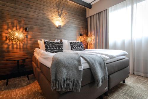 乌拿斯瓦天空拉普兰酒店客房内的一张或多张床位