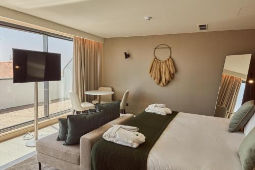 OMID Saldanha Hotel客房内的一张或多张床位