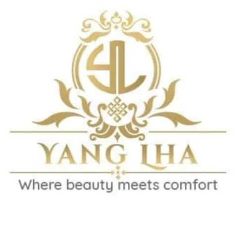 列城YANG-LHA GUEST HOUSE的带有 ⁇ 图瓦标志的化妆品公司的标志