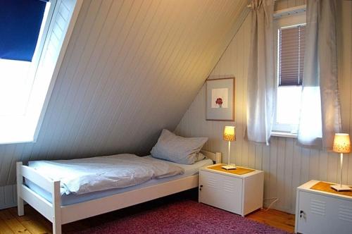 Inselhaus OG客房内的一张或多张床位