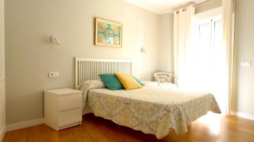 Sevilla Alameda PG Apartamentos客房内的一张或多张床位