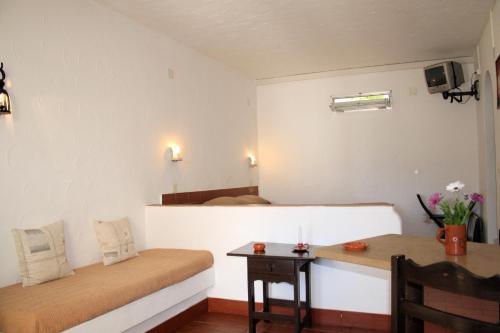 马索尔旅游公寓酒店客房内的一张或多张床位