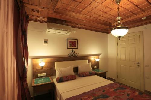 奥斯曼哥科娃酒店客房内的一张或多张床位