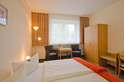 Hotel Harz客房内的一张或多张床位