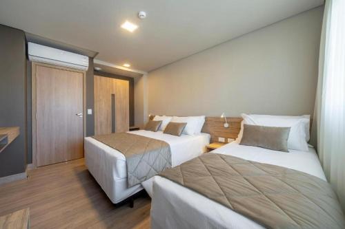 Golden Gramado Resort客房内的一张或多张床位