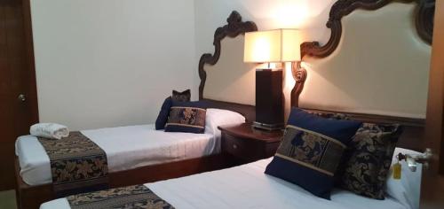 Hotel Mina Vetagrande客房内的一张或多张床位