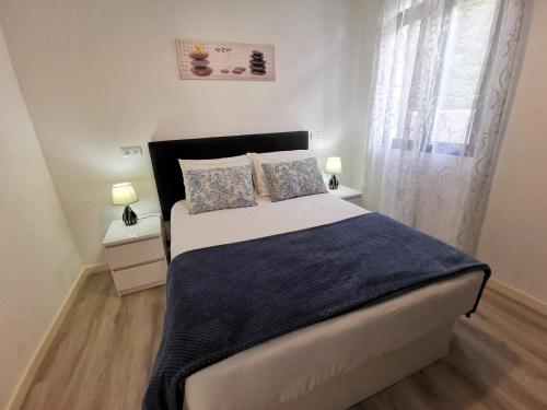 Charming Apartment in Funchal – Lazareto客房内的一张或多张床位