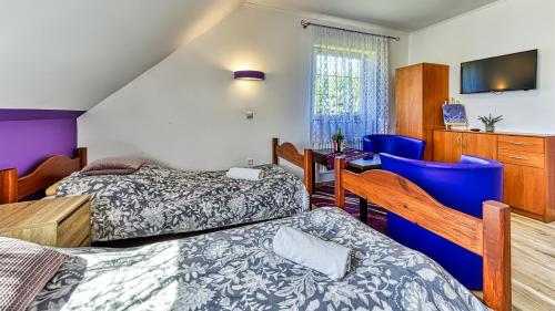 Wydrza-Przystań客房内的一张或多张床位