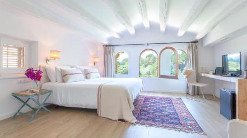 Hotel Mas Pastora - Adults Only客房内的一张或多张床位