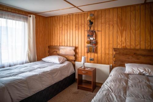 Hostal Lejana Patagonia客房内的一张或多张床位