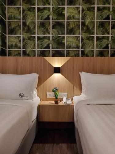 Apex Boutique Hotel @ Bandar Sunway客房内的一张或多张床位