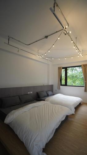 花莲温叨行旅HYGGE－可包栋客房内的一张或多张床位