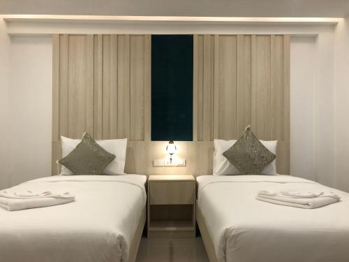 Vista Hotel Chiang Mai - SHA EXTRA PLUS客房内的一张或多张床位