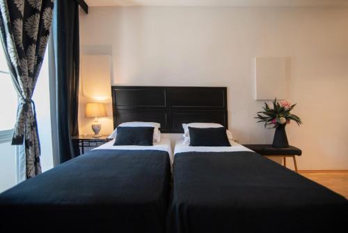 埃姆帕里康雅典酒店客房内的一张或多张床位