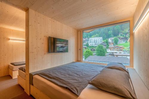 Revier Mountain Lodge Adelboden客房内的一张或多张床位