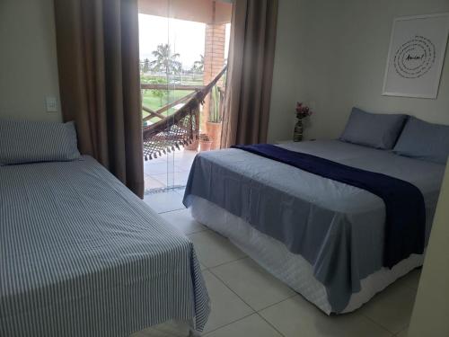 Apart Resort Vila das Águas Veraneio客房内的一张或多张床位