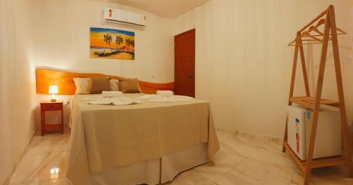 Japaratinga Suites客房内的一张或多张床位