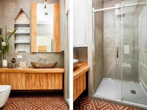 米兰Vallazze Luxury的一间带玻璃淋浴和水槽的浴室