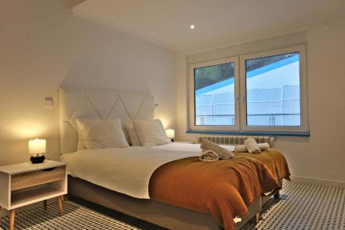 Mega Ocean Magoito - Guest House - Sintra客房内的一张或多张床位