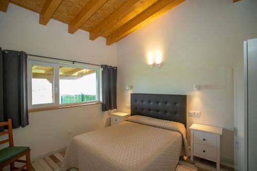 Apartamentos Rurales Miramar客房内的一张或多张床位