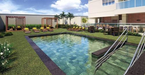 坎皮纳斯Maravilhoso Studio Flat Apto no Bosque - Campinas的一座建筑物的院子内的游泳池