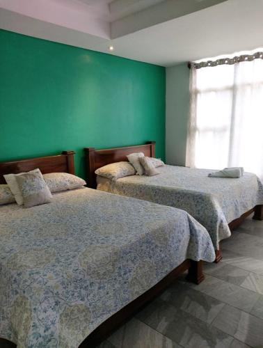 Pura vida apartments客房内的一张或多张床位