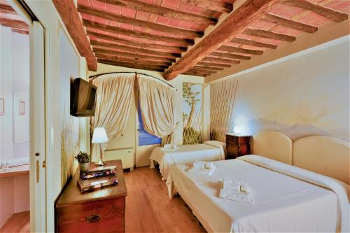 阿尔伯托圣马蒂诺酒店客房内的一张或多张床位