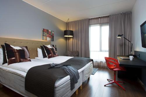 斯堪斯塔万格坲鲁斯酒店客房内的一张或多张床位