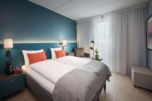 奥斯陆机场斯堪迪克酒店客房内的一张或多张床位