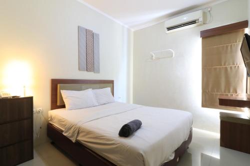 Uptown Residence Syariah Pondok Pinang客房内的一张或多张床位