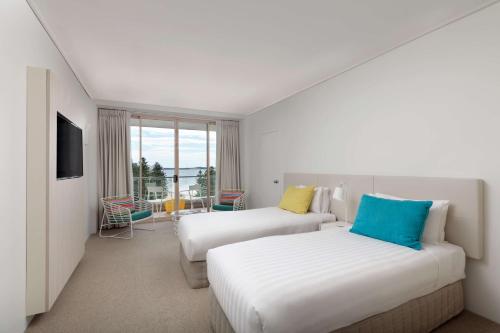 Rydges Cronulla Beachside客房内的一张或多张床位