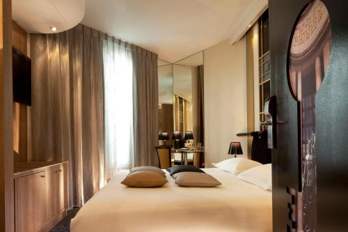 Secret de Paris - Hotel & Spa客房内的一张或多张床位