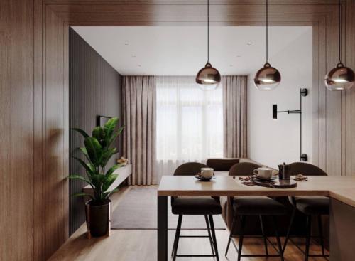 白采尔科维Дизайнерские Апартаменты класса Люкс!的厨房以及带桌椅的用餐室。