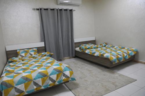 Aljood Resort客房内的一张或多张床位