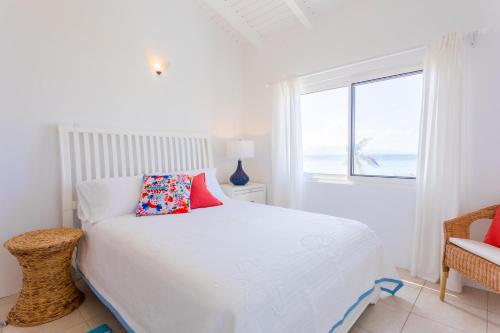 Coralito Bay Suites & Villas客房内的一张或多张床位